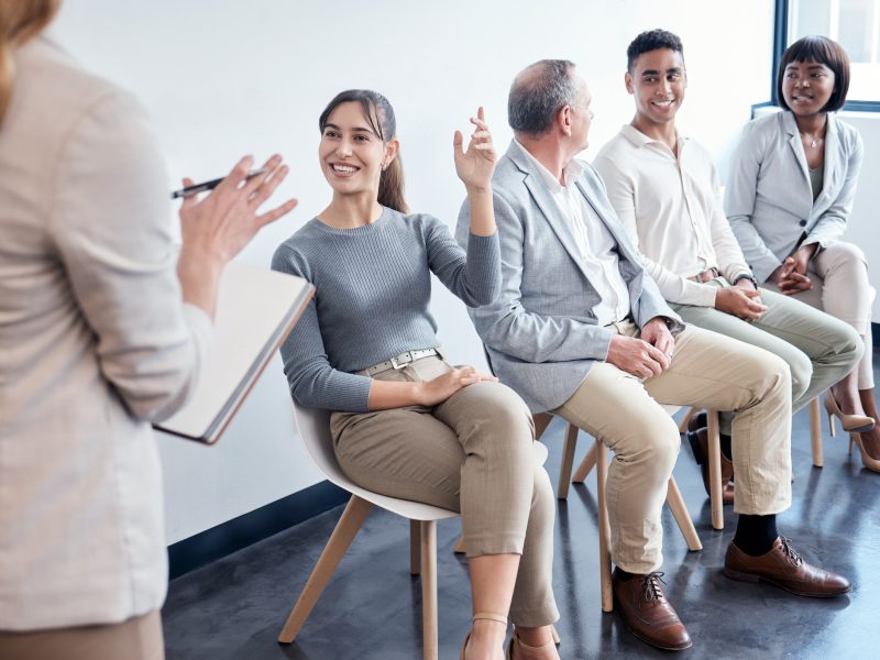 shot of a group of new employees having a discussion with the recruiter at an office